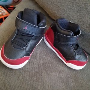 Red and black jordans size 5c